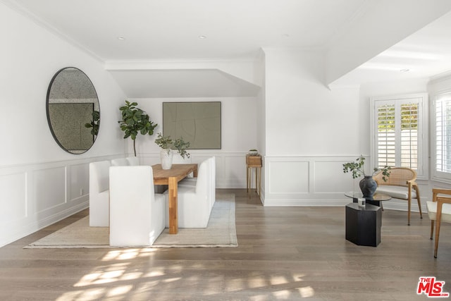 dining area featuring crown molding and hardwood / wood-style floors