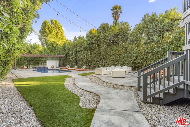 view of yard featuring a pergola, an outdoor hangout area, and a patio