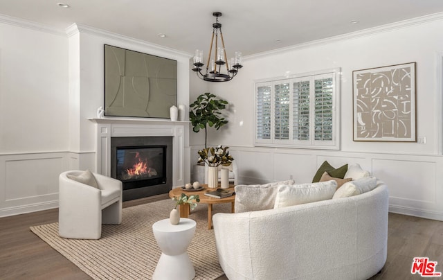 living room featuring crown molding, dark hardwood / wood-style flooring, and an inviting chandelier