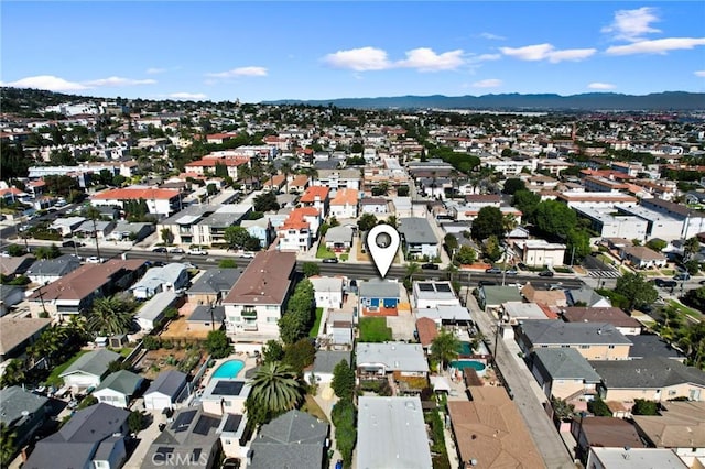 birds eye view of property with a mountain view