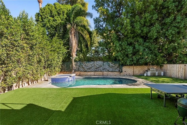 view of pool with area for grilling, an in ground hot tub, and a yard