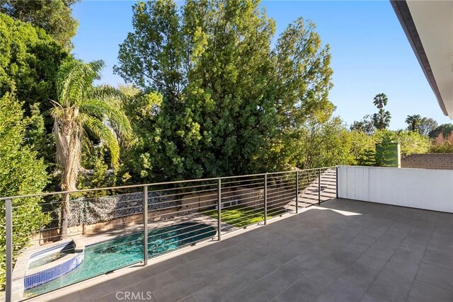 view of patio with a fenced in pool