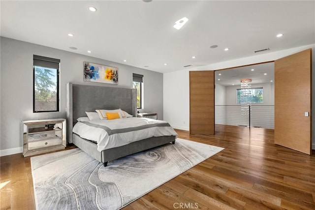 bedroom with hardwood / wood-style flooring