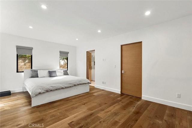 bedroom with hardwood / wood-style flooring