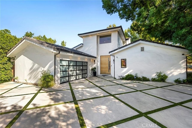 back of house with a garage