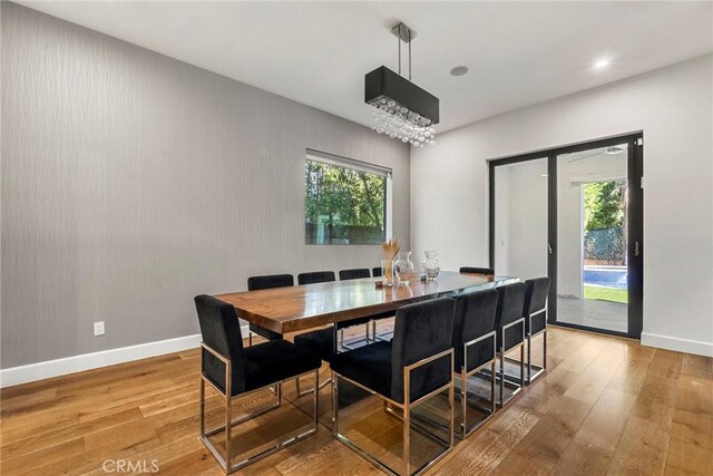 dining room featuring a wealth of natural light and light wood-type flooring