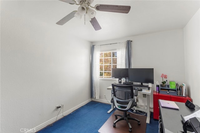 office area featuring ceiling fan and dark colored carpet