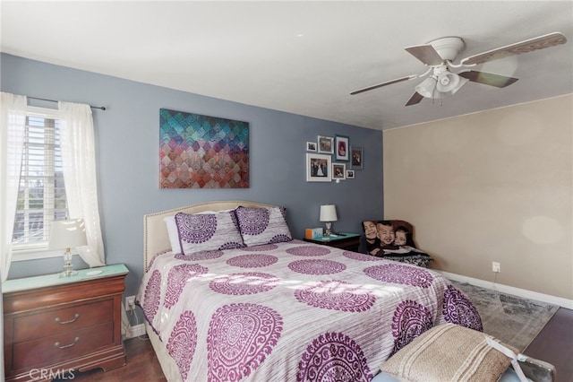 bedroom with wood-type flooring and ceiling fan