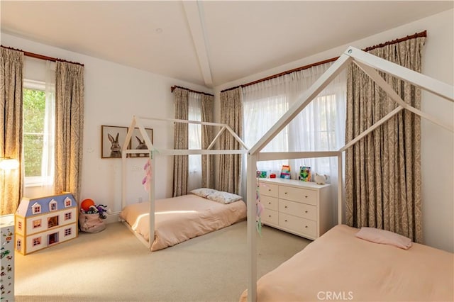 carpeted bedroom with vaulted ceiling