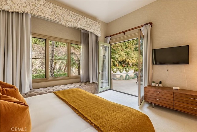 carpeted bedroom featuring access to exterior