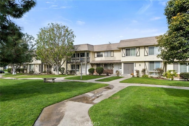 view of home's community with a lawn