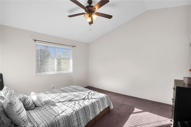 carpeted bedroom with vaulted ceiling and ceiling fan