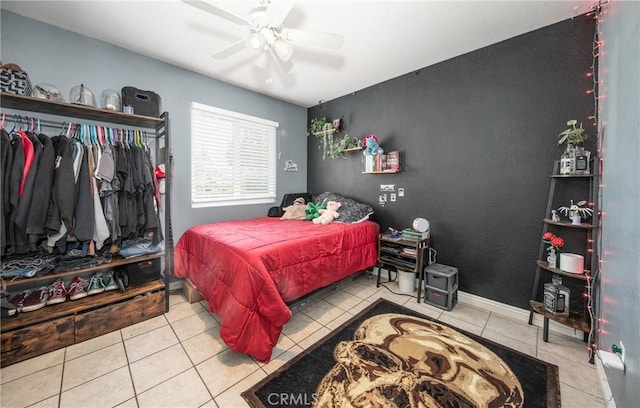 tiled bedroom with ceiling fan