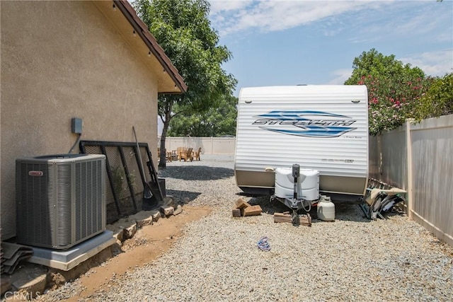 view of yard featuring central air condition unit