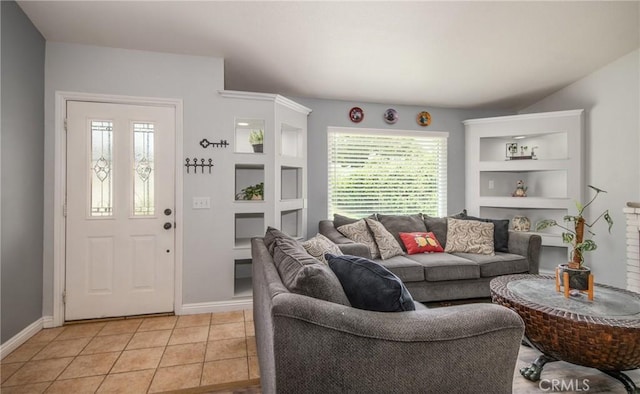 living room with a wealth of natural light and light tile patterned flooring