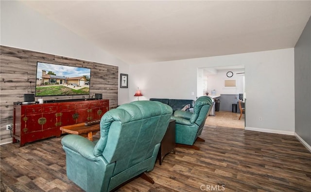 living room featuring lofted ceiling and dark hardwood / wood-style floors