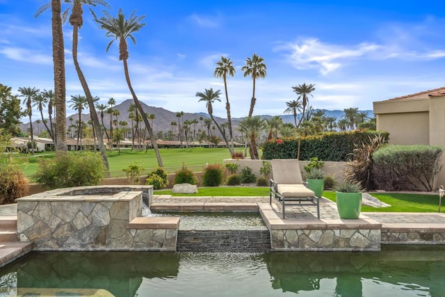 exterior space with a mountain view and a patio