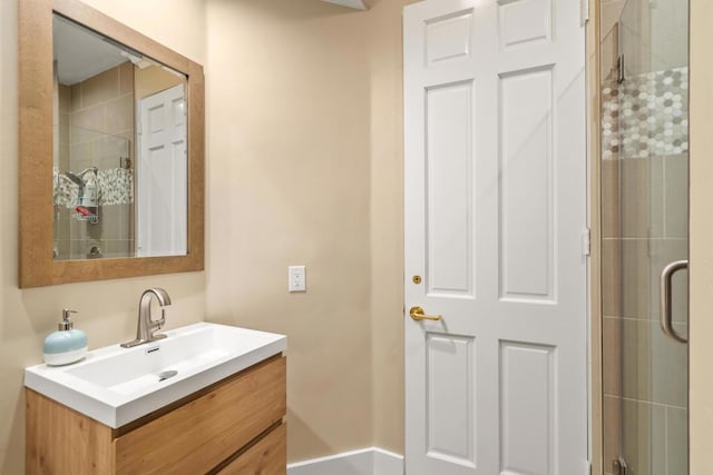 bathroom with vanity and an enclosed shower