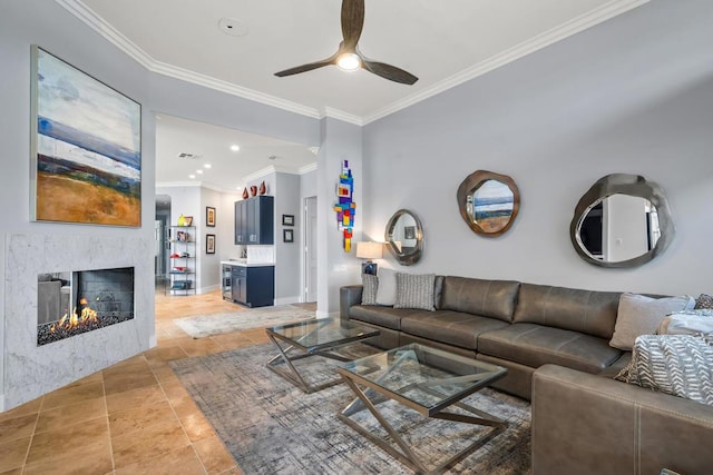 tiled living room featuring ornamental molding and ceiling fan