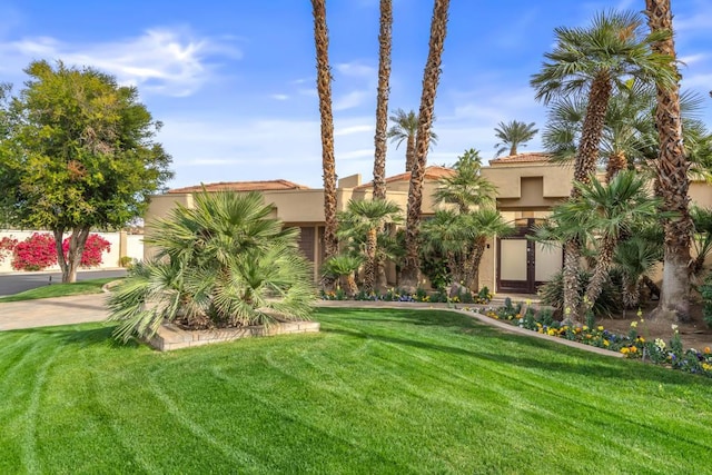 view of front of home with a front lawn