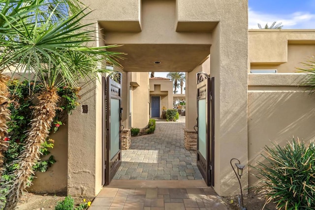 doorway to property featuring a patio area