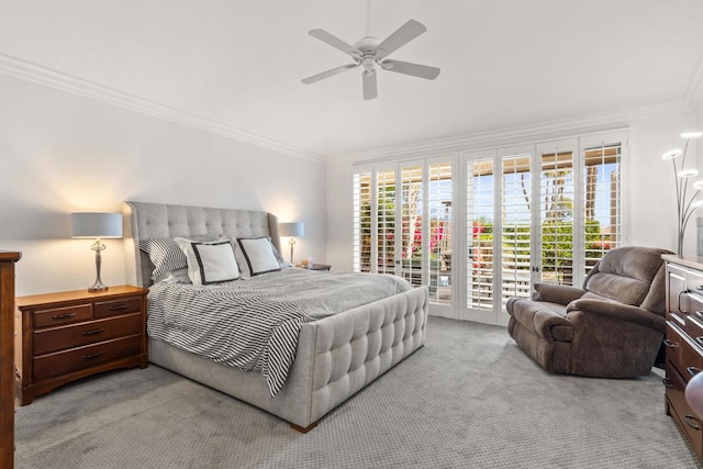 bedroom with ceiling fan, ornamental molding, access to exterior, and multiple windows