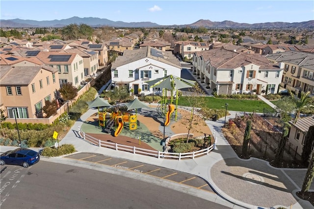 birds eye view of property with a mountain view