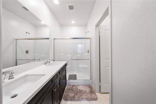 bathroom with vanity and walk in shower