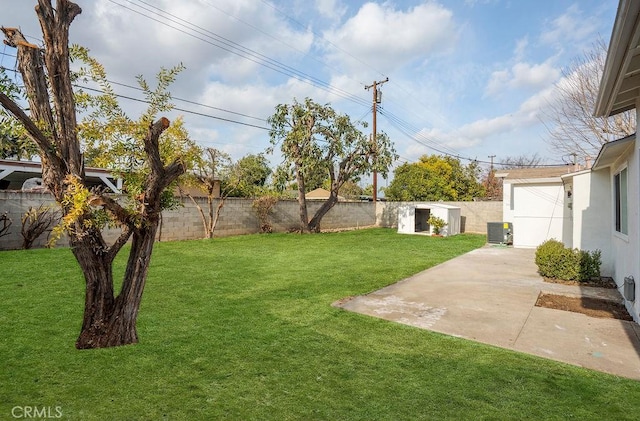 view of yard featuring a shed, a patio, and central air condition unit