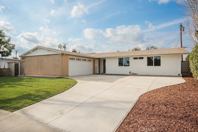 ranch-style home featuring a garage and a front yard