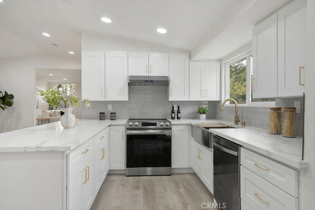 kitchen with lofted ceiling, stainless steel electric range oven, dishwasher, kitchen peninsula, and white cabinets