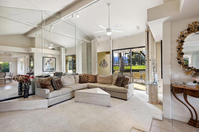 carpeted living room featuring ceiling fan and high vaulted ceiling