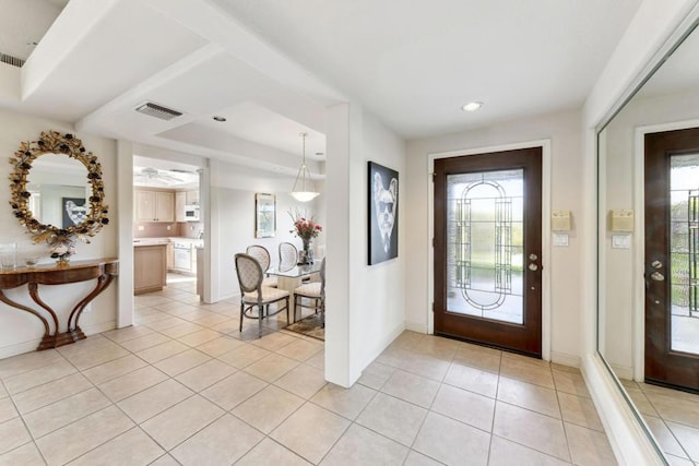 entryway featuring light tile patterned floors