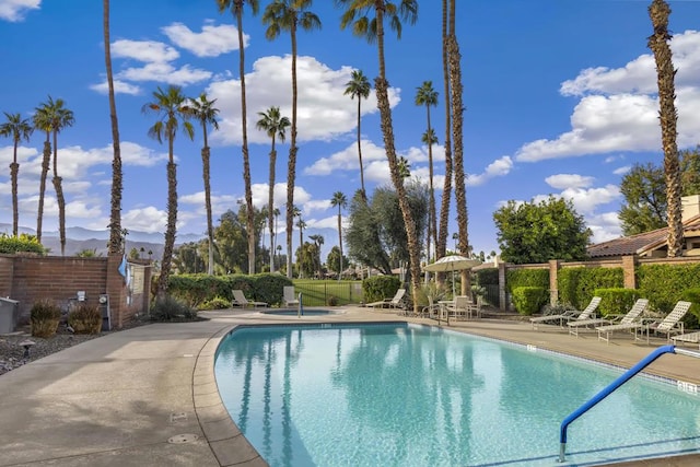 view of swimming pool featuring a patio area