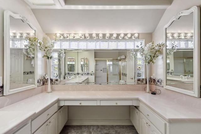 bathroom featuring vanity, an enclosed shower, and vaulted ceiling