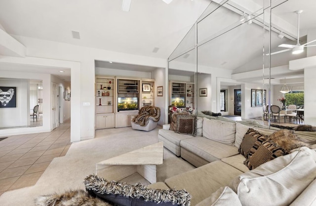 tiled living room featuring ceiling fan, high vaulted ceiling, and beamed ceiling