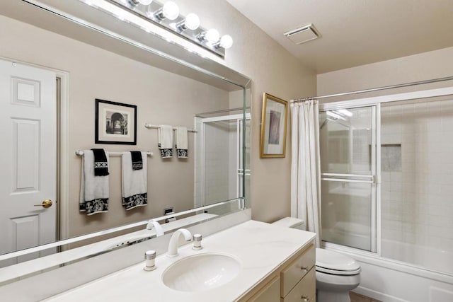 full bathroom with vanity, toilet, and combined bath / shower with glass door