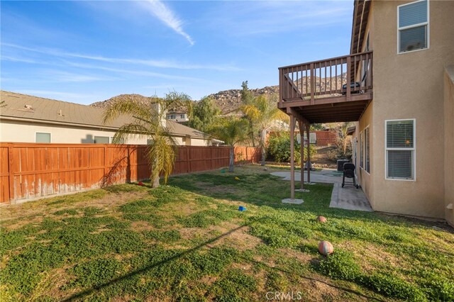 view of yard with a patio and a deck