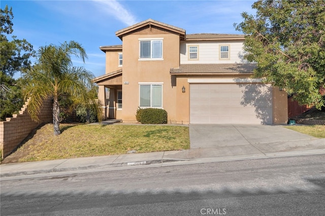 front of property with a garage and a front yard