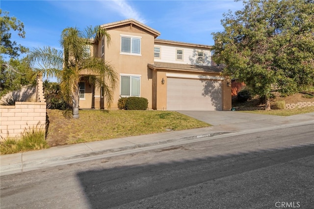 traditional-style home with concrete driveway, stucco siding, an attached garage, fence, and a front yard