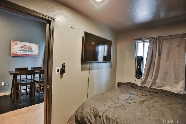 bedroom featuring hardwood / wood-style flooring