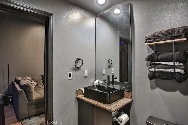 bathroom featuring vanity and hardwood / wood-style flooring