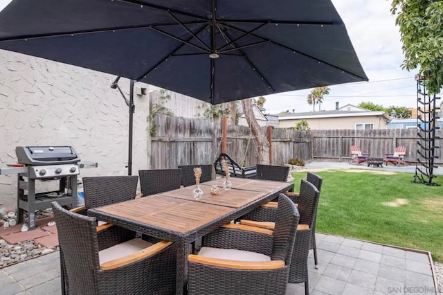 view of patio / terrace featuring grilling area and an outdoor fire pit