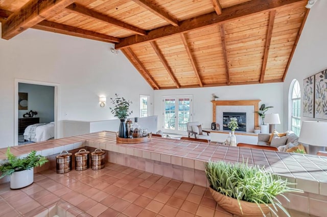 tiled living room with beamed ceiling, high vaulted ceiling, and wooden ceiling