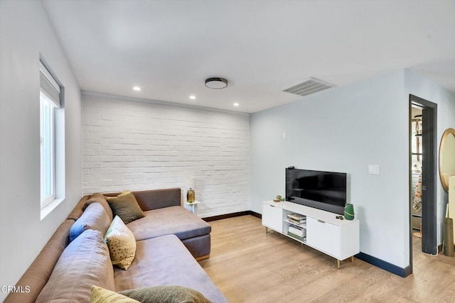 living room with light hardwood / wood-style floors