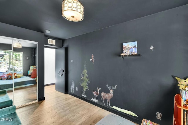 bedroom with wood-type flooring