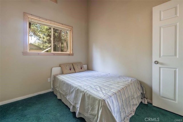 bedroom with dark carpet