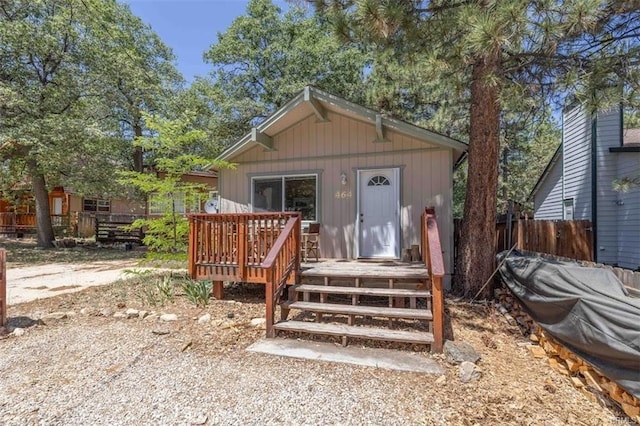 exterior space featuring an outbuilding and a deck