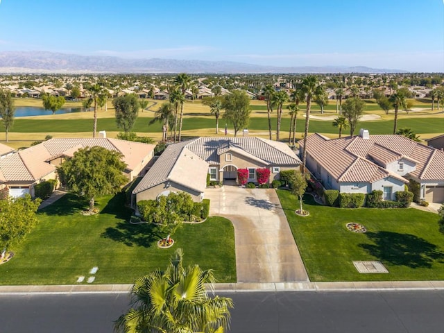 birds eye view of property with a water and mountain view