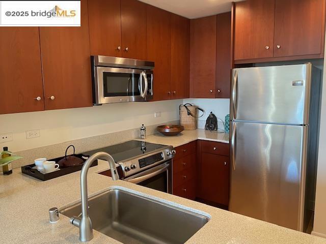 kitchen featuring stainless steel appliances and sink